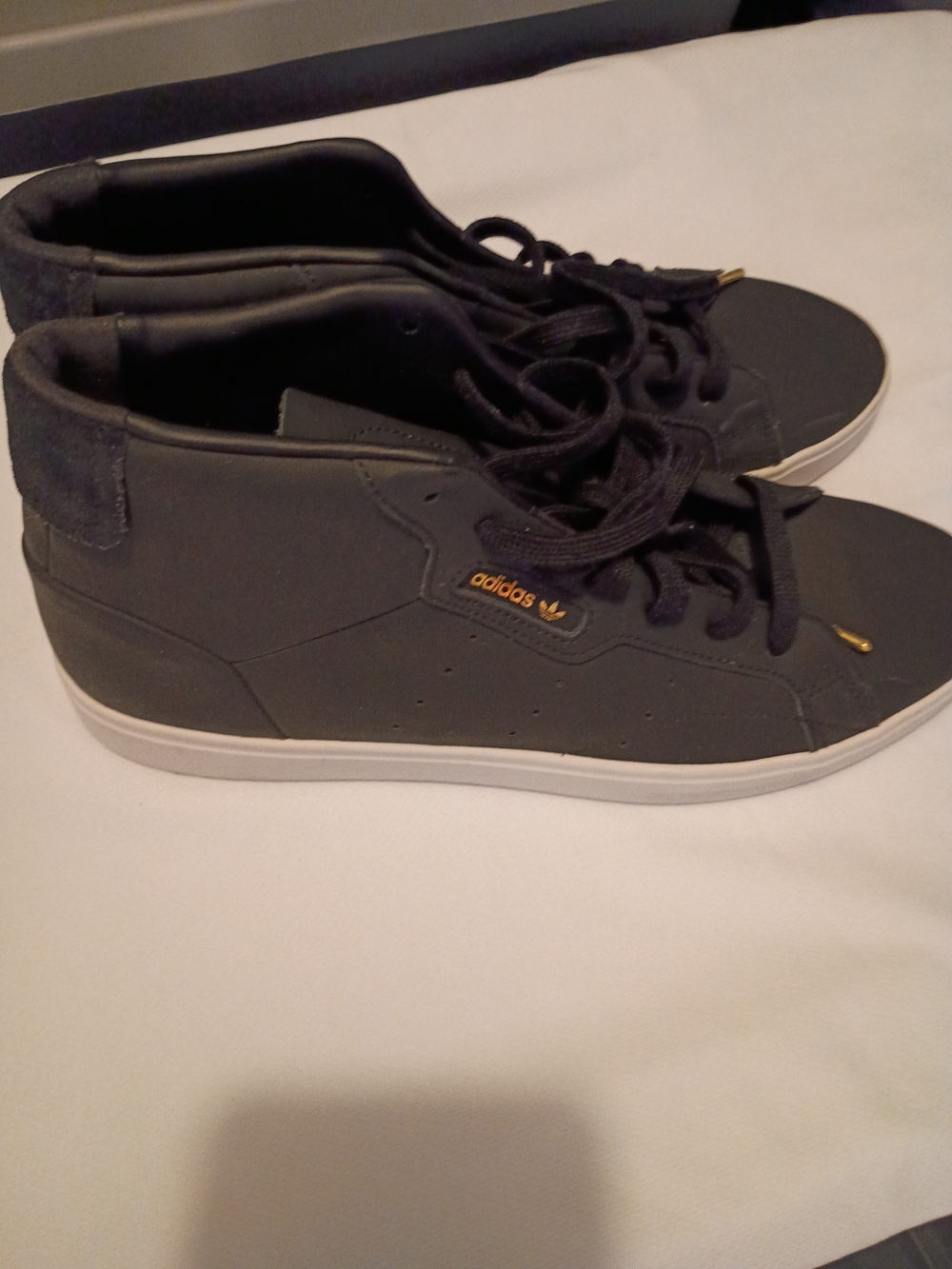 adidas Men’s Black High-Top Sneakers with Gold Accent
